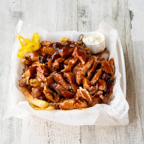 No Sauce AZ Smokehouse BBQ chicken and fries with a side of coleslaw and pickled peppers.